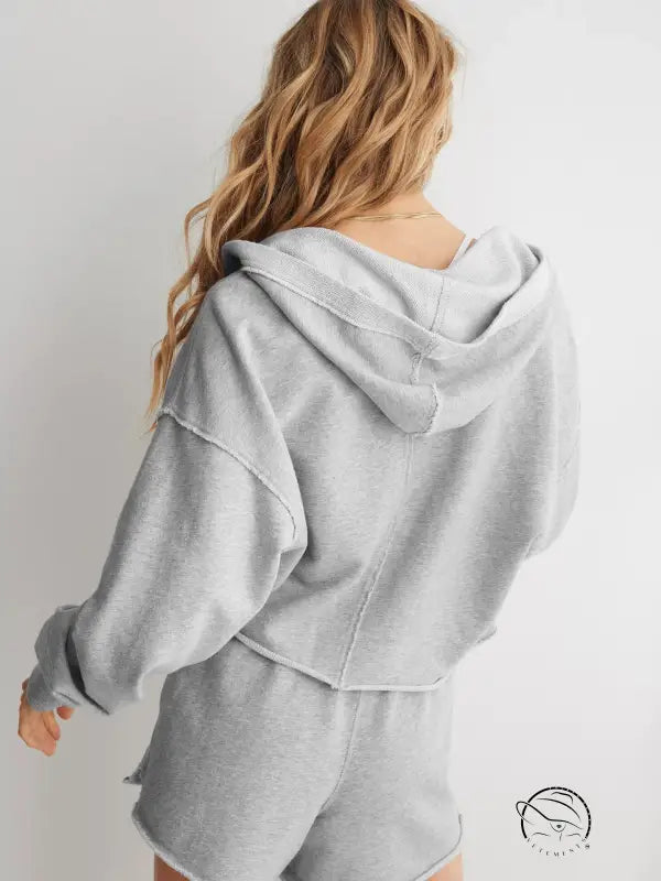 Light gray cozy loose hooded sweatshirt from behind on blonde wavy hair model, langry fashion ملابس