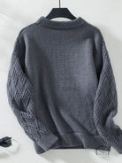 Charcoal gray crew neck cable knit sweater with textured sleeves