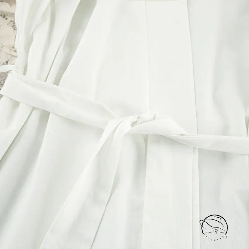 White soft-textured cotton langry robe with tied waistband, lace up fashion nightgown