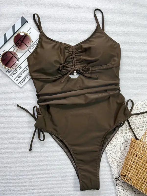 Brown cutout strap one-piece swimsuit with olive-brown ruched sides