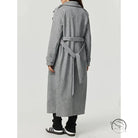 Long gray wool trench coat with double-breasted buttons and belt, cozy woolen fashion outerwear
