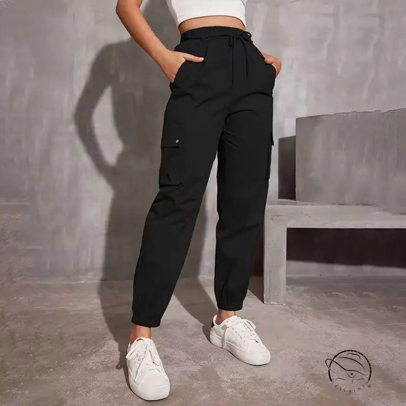 High waist wide leg black cargo jogger pants with white sneakers