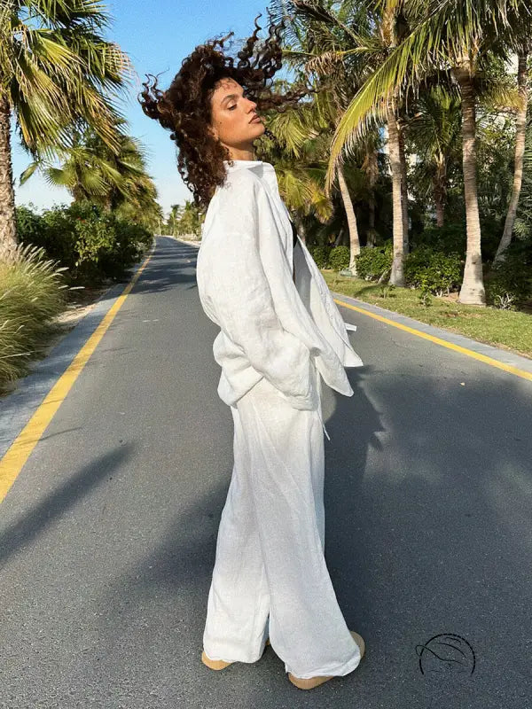 Woman in white linen cotton shirt trousers casual set