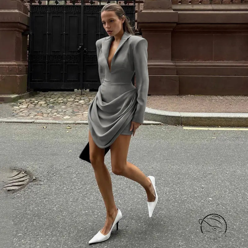 Slim deep V plunge neck blazer dress with ruched detailing and white heels