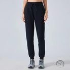 Black casual loose tapered sports pants with drawstring waist and elastic cuffs