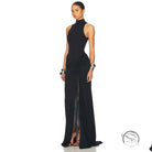 Black high-neck sleeveless gown with tight waist, high split, and draped detail