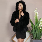 Cozy black faux fur hooded coat with plush texture and v-neckline from Langry fashion