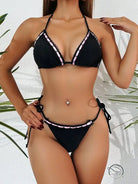 Jaw-dropping swimsuit: black triangle bikini with white ruffled trim