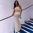 Woman in a sheer strapless dress from the Beautiful Mesh Stitching Dress collection, showcasing modern fashion trends