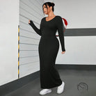 Black ribbed knit maxi dress in winter minimalist slim fit sheath style