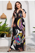 Woman in colorful butterfly print holiday beach dress