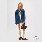 Casual fashionable cowboy coat in light-wash denim with ties