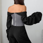 Langry fashion black off-shoulder jumpsuit with puffed sleeves and zipper detail
