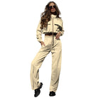 Woman wearing an elegant Vetements suit featuring beige casual trousers and long sleeves