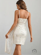 Shimmering white langry fashion dress with spaghetti straps and draped panel