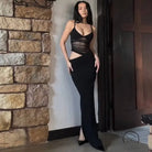 Elegant mesh dress in black with sheer cutouts, form-fitting fashion