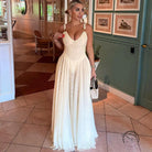 Elegant backless strap mesh dress in cream satin with deep V-neck