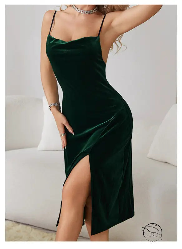 Emerald green velvet langry slip dress with spaghetti straps and high slit