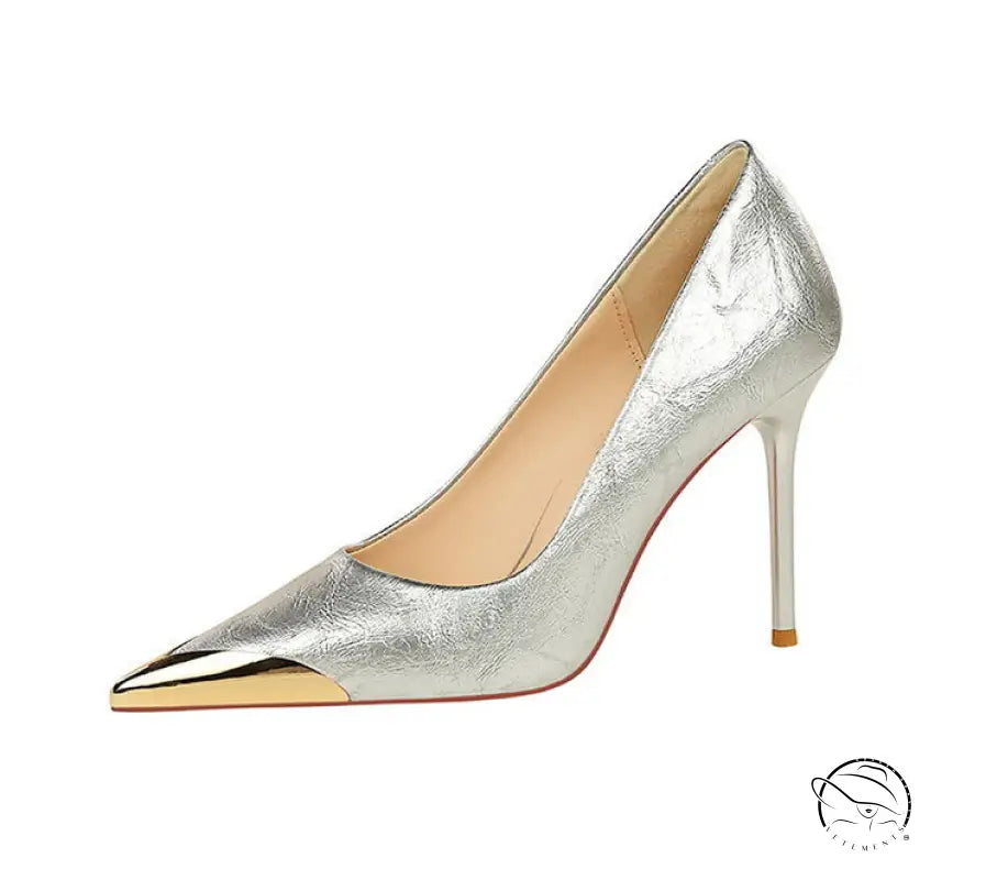 Silver metal pointed super high heel pump with gold toe cap and orange sole by Langry