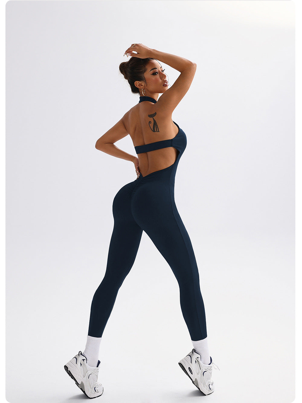 Sleek Langry navy yoga jumpsuit with cut-out back in fashion ملابس