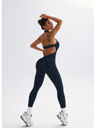 Sleek Langry navy yoga jumpsuit with cut-out back in fashion ملابس