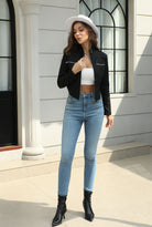 Langry fashion black leather jacket with silver zippers and high-waisted jeans
