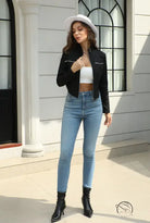 Dark autumn Langry fashion black leather jacket with silver zippers and high-waisted jeans