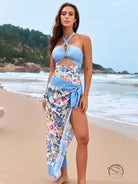 Stunning light blue one piece swimsuit with halter top and floral sarong skirt