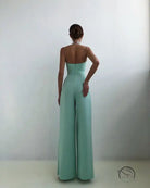 Elegant mint green strapless modern jumpsuit with wide-leg pants