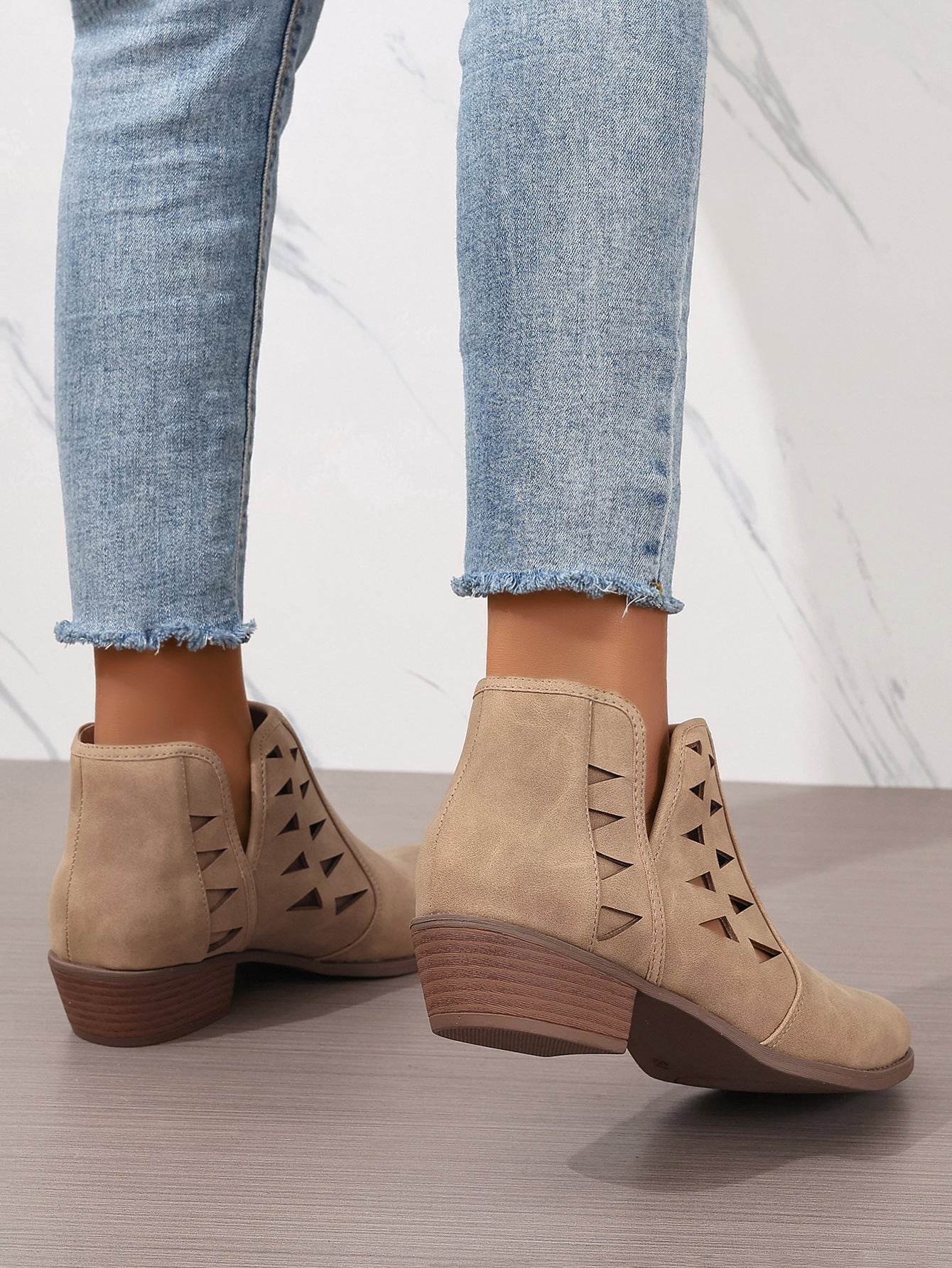 Beige suede Daily Ankle Boots featuring side cutout details and low stacked heels