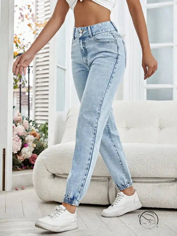 Light wash blue drooping loose denim pants with high waist and elastic cuffs