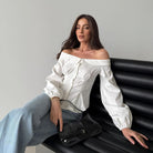 Elegant French off-shoulder shirt showcasing a white blouse with puffy sleeves, fashion ملابس