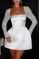 White satin mini dress with beaded sleeves for casual meetings, perfect for modern fashion