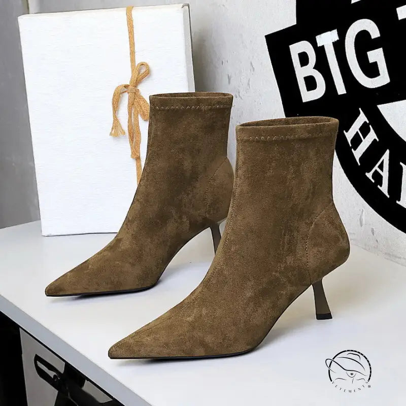 Brown suede ankle boots with pointed toes and low heels in Langry fashion