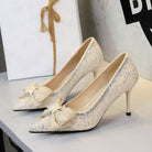 Langry fashion glittery gold stiletto pumps with bowknot rhinestones