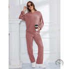 Woman in mauve ribbed hooded casual suit lounge set