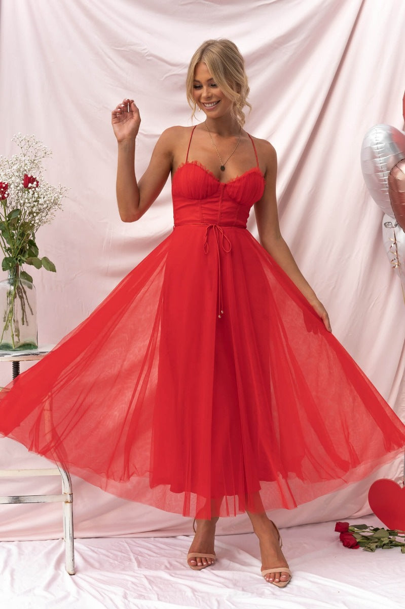 Elegant sling dress in red chiffon showcasing a sexy sling dress style for evening events