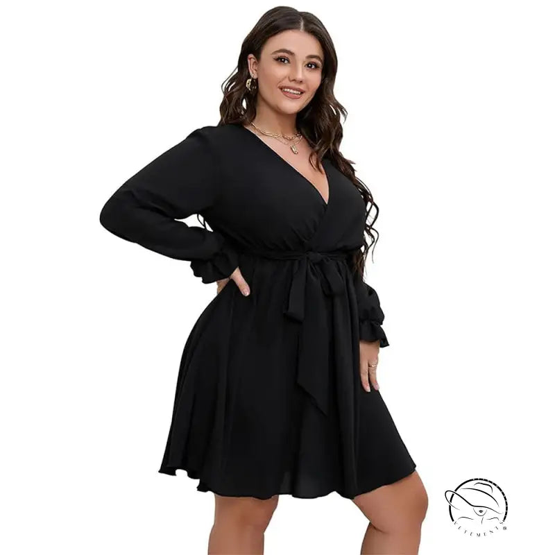 Plus-size woman in black winter office midi dress with V-neck and tie