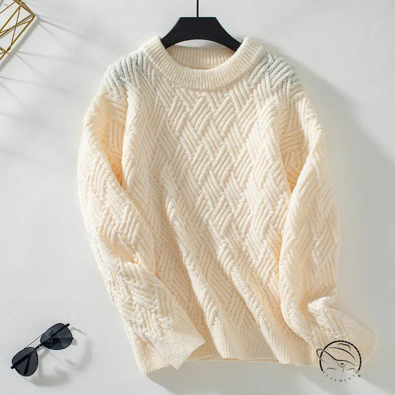 Cream cable knit crew neck sweater with long sleeves and textured pattern