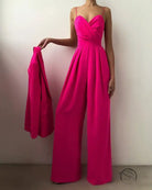 Elegant modern jumpsuit in hot pink strapless design with wide-leg pants and wrap