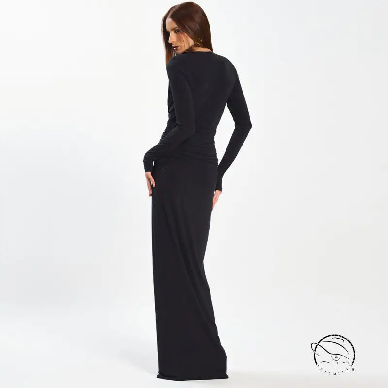Black stretch jersey maxi dress with long sleeves and fitted waist, enchanting fashion