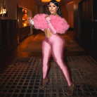 Pink feathered glove and high-heeled shoes in long sleeve fashion jumpsuit