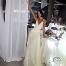 Elegant backless strap mesh dress in ivory lace with deep V-neck