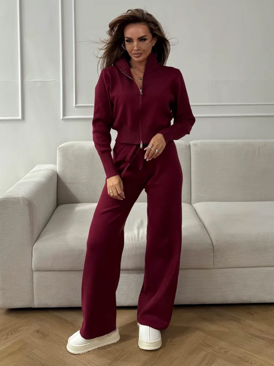 Langry fashion burgundy zip-up jumpsuit with wide-leg pants and white sneakers