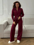 Burgundy langry fashion jumpsuit with wide-leg pants and white sneakers
