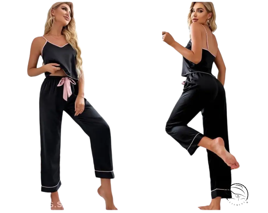 Black satin pajama set with pink ribbon tie and white piping details, plus black eye mask