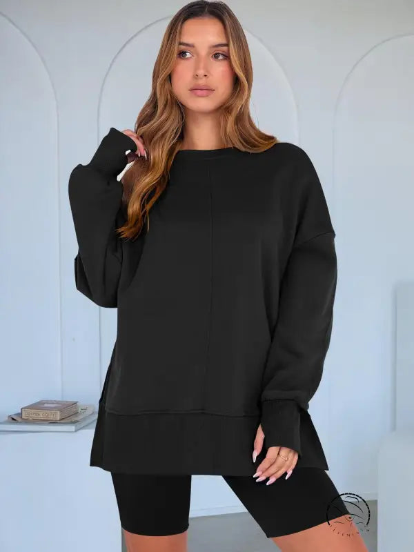 Black oversized langry fashion sweatshirt with long sleeves and side pockets