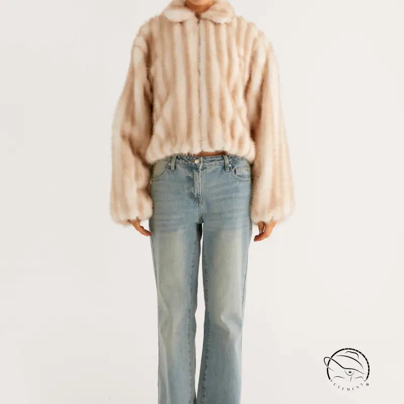 Beige faux fur cropped jacket with hood and striped pattern over light wash denim flared jeans