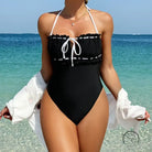 White black ruffled one-piece swimsuit with halter tie neckline by Langry