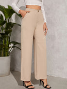 High-waisted beige wide-leg trousers with side pockets for elegant fashion styling